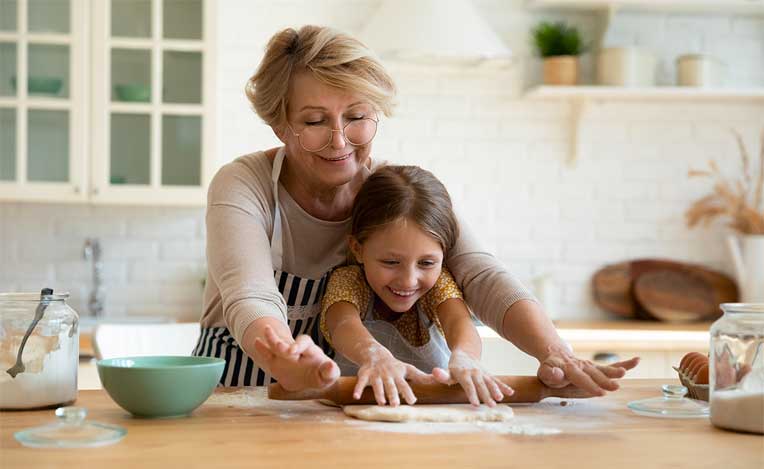 Grandmother and niece cooking